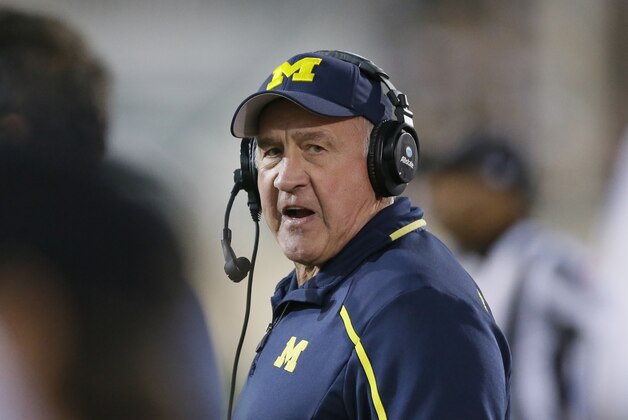 Michigan defensive coordinator Greg Mattison walks the sidelines during the second half of an NCAA college football game against Michigan State in East Lansing, Mich., Saturday, Oct. 25, 2014. (AP Photo/Carlos Osorio)
