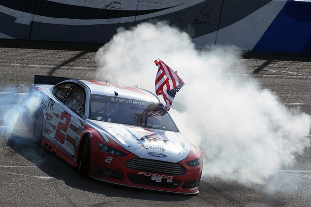 FONTANA, CA - MARCH 22:  Brad Keselowski, driver of the #2 Wurth Ford, celebrates after winning the NASCAR Sprint Cup Series Auto Club 400 at Auto Club Speedway on March 22, 2015 in Fontana, California.  (Photo by Robert Laberge/Getty Images)