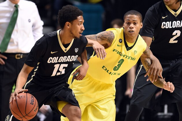 LAS VEGAS, NV - MARCH 12:  Dominique Collier #15 of the Colorado Buffaloes drives against Joseph Young #3 of the Oregon Ducks during a quarterfinal game of the Pac-12 Basketball Tournament at the MGM Grand Garden Arena on March 12, 2015 in Las Vegas, Nevada. Oregon won 93-85.  (Photo by Ethan Miller/Getty Images)