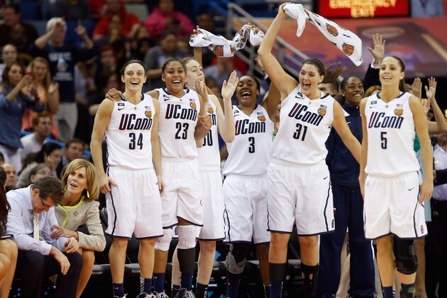 NEW ORLEANS, LA - APRIL 09:  Kelly Faris #34, Kaleena Mosqueda-Lewis #23, Breanna Stewart #30, Morgan Tuck #3, Stefanie Dolson #31 and Caroline Doty #5 of the Connecticut Huskies celebrate late in the game against the Louisville Cardinals during the 2013 NCAA Women's Final Four Championship at New Orleans Arena on April 9, 2013 in New Orleans, Louisiana.  (Photo by Chris Graythen/Getty Images)
