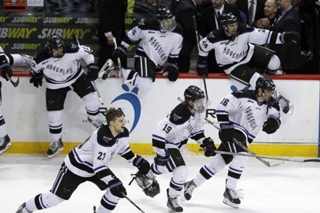 Minnesota State Mankato forwards Teddy Blueger (23),  Brad McClure (19), and Jordan Nelson (16) join teammates in celebration after defeating Michigan Tech 5-2 to win the WCHA Final Five college championship hockey game in St. Paul, Minn., Saturday, March 21, 2015. (AP Photo/Ann Heisenfelt)