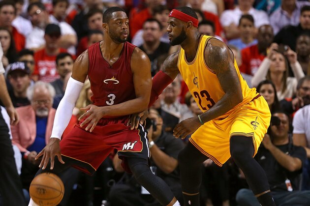 MIAMI, FL - DECEMBER 25:  Dwyane Wade #3 of the Miami Heat posts up LeBron James #23 of the Cleveland Cavaliers during a game  at American Airlines Arena on December 25, 2014 in Miami, Florida. NOTE TO USER: User expressly acknowledges and agrees that, by downloading and/or using this photograph, user is consenting to the terms and conditions of the Getty Images License Agreement. Mandatory copyright notice:  (Photo by Mike Ehrmann/Getty Images)