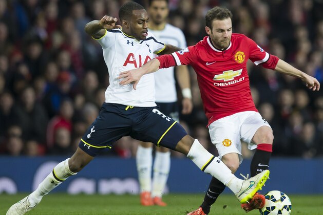 Manchester United's Juan Mata, right, keeps the ball from Tottenham Hotspur's Danny Rose during the English Premier League soccer match between Manchester United and Tottenham Hotspur at Old Trafford Stadium, Manchester, England, Sunday March 15, 2015. (AP Photo/Jon Super)