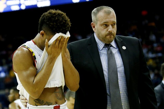COLUMBUS, OH - MARCH 22:  Melo Trimble #2 of the Maryland Terrapins is helped off of the court after being injured for a second time in the second half against the West Virginia Mountaineers during the third round of the 2015 NCAA Men's Basketball Tournament at Nationwide Arena on March 22, 2015 in Columbus, Ohio.  (Photo by Kirk Irwin/Getty Images)
