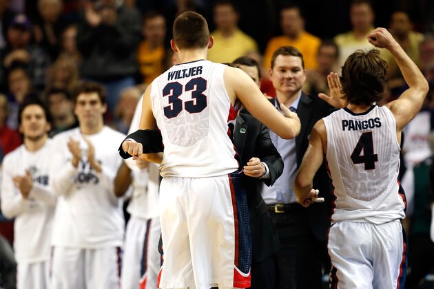SEATTLE, WA - MARCH 22:  Kyle Wiltjer #33 of the Gonzaga Bulldogs and teammate Kevin Pangos #4 celebrate with head coach Mark Few after defeating the Iowa Hawkeyes 87 to 68 during the third round of the 2015 NCAA Men's Basketball Tournament at KeyArena on March 22, 2015 in Seattle, Washington.  (Photo by Ezra Shaw/Getty Images)
