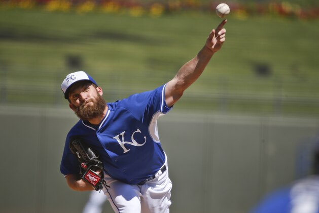 Kansas City Royals starting pitcher Danny Duffy throws against the San Francisco Giants in the first inning of a spring training baseball game Sunday, March 22, 2015, in Surprise, Ariz. (AP Photo/Lenny Ignelzi)