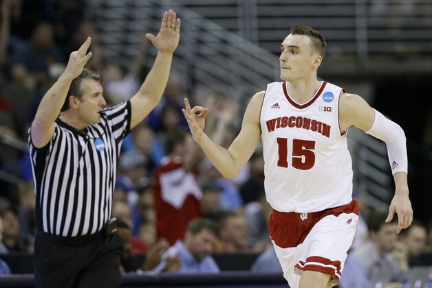 Wisconsin forward Sam Dekker reacts after making a three-point basket during the second half of an NCAA college basketball tournament Round of 32 game against Oregon, Sunday, March 22, 2015, in Omaha, Neb. (AP Photo/Charlie Neibergall)
