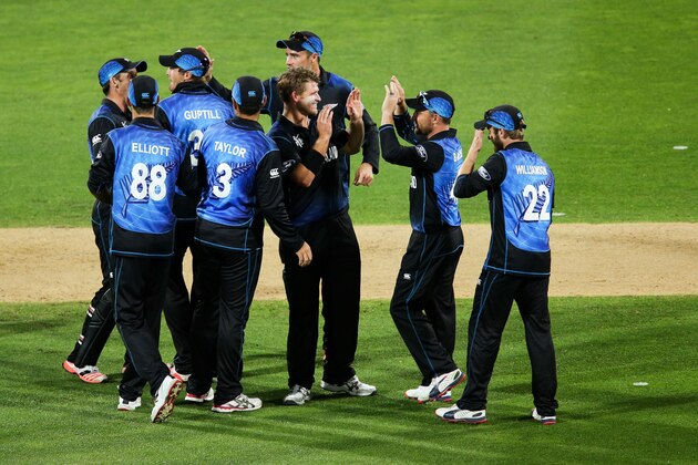 WELLINGTON, NEW ZEALAND - MARCH 21:  Corey Anderson of New Zealand is congratulated by teammate Brendon McCullum after taking the wicket of Darren Sammy of the West Indies during the 2015 ICC Cricket World Cup match between New Zealand and the West Indies at Wellington Regional Stadium on March 21, 2015 in Wellington, New Zealand.  (Photo by Hagen Hopkins/Getty Images)