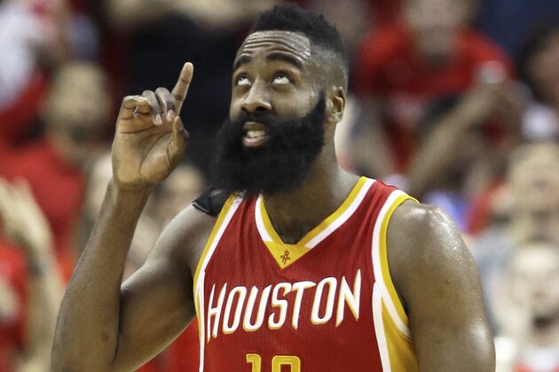 Houston Rockets' James Harden points upward after hitting a three-point shot against the Denver Nuggets in the final seconds of an NBA basketball game Thursday, March 19, 2015, in Houston. Harden scored a career-high 50 points and grabbed 10 rebounds. The Rockets won 118-108. (AP Photo/Pat Sullivan)