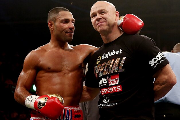 SHEFFIELD, ENGLAND - OCTOBER 26:  Kell Brook celebrates his victory over Vyacheslav Senchenko with Dominic Ingle during their Final Eliminator for the IBF World Welterweight Championship bout at Motorpoint Arena on October 26, 2013 in Sheffield, England.  (Photo by Scott Heavey/Getty Images)