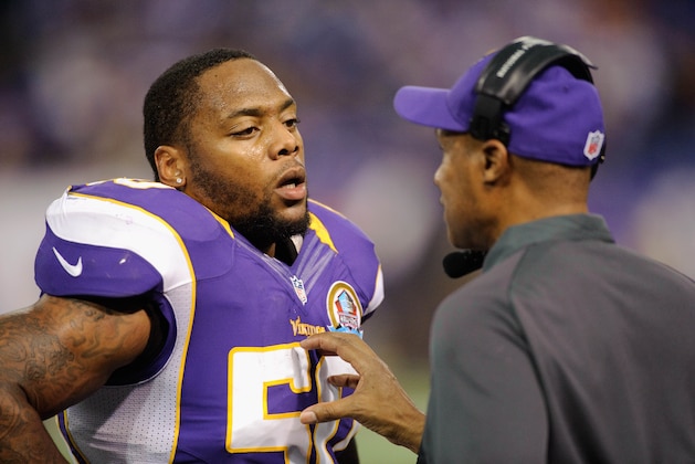 MINNEAPOLIS, MN - DECEMBER 9: Erin Henderson #50 and Leslie Frazier of the Minnesota Vikings speak during the game against the Chicago Bears on December 9, 2012 at Mall of America Field at the Hubert H. Humphrey Metrodome in Minneapolis, Minnesota. (Photo by Hannah Foslien/Getty Images)