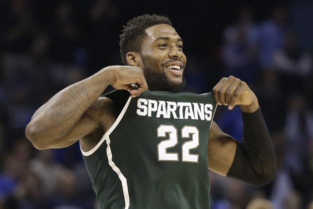 Michigan State's Branden Dawson (22) celebrates after an NCAA tournament college basketball game against Virginia in the Round of 32 in Charlotte, N.C., Sunday, March 22, 2015. Michigan State won 60-54. (AP Photo/Nell Redmond)