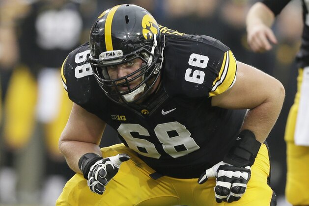 Iowa offensive lineman Brandon Scherff looks to block during the first half of an NCAA college football game against Wisconsin, Saturday, Nov. 22, 2014, in Iowa City, Iowa. (AP Photo/Charlie Neibergall)