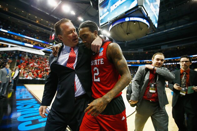 PITTSBURGH, PA - MARCH 21: Head coach Mark Gottfried walks off the floor with Anthony Barber #12 of the North Carolina State Wolfpack following their 71-68 win over the Villanova Wildcats during the third round of the 2015 NCAA Men's Basketball Tournament at Consol Energy Center on March 21, 2015 in Pittsburgh, Pennsylvania.  (Photo by Jared Wickerham/Getty Images)