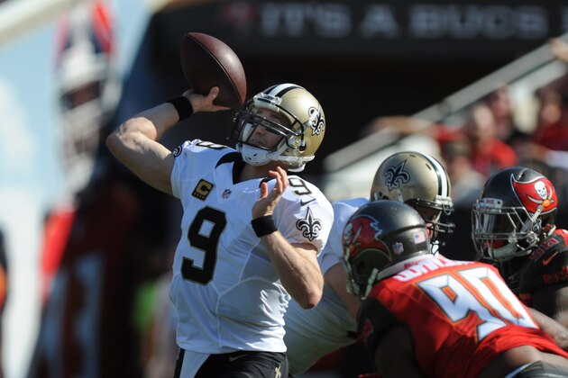 TAMPA, FL - DECEMBER 28: Quarterback Drew Brees #9 of the New Orleans Saints throws a pass against the Tampa Bay Buccaneers in the first quarter at Raymond James Stadium on December 28, 2014 in Tampa, Florida. (Photo by Cliff McBride/Getty Images)