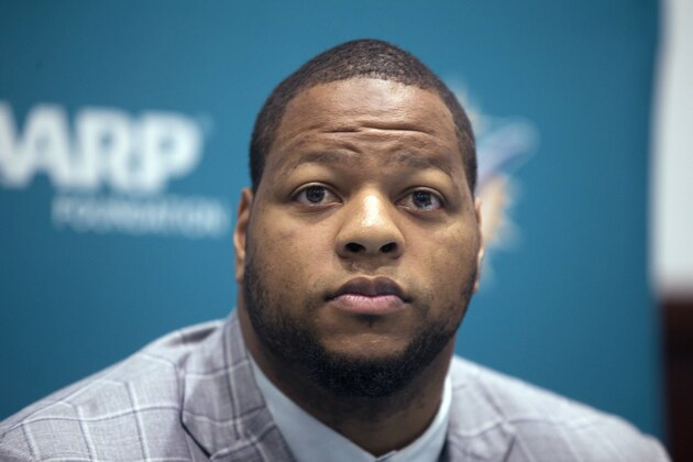 Miami Dolphins' Ndamukong Suh listens during an NFL football news conference in Davie, Fla., Wednesday, March 11, 2015. Suh signed a $114 million, six-year deal with the Dolphins on Wednesday (AP Photo/J Pat Carter)