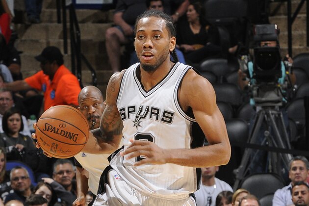 SAN ANTONIO, TX - MARCH 15:  Kawhi Leonard #2 of the San Antonio Spurs brings the ball up court against the Minnesota Timberwolves on March 15, 2015 at the AT&T Center in San Antonio, Texas. NOTE TO USER: User expressly acknowledges and agrees that, by downloading and or using this Photograph, user is consenting to the terms and conditions of the Getty Images License Agreement. Mandatory Copyright Notice: Copyright 2015 NBAE (Photo by D. Clarke Evans/NBAE via Getty Images)