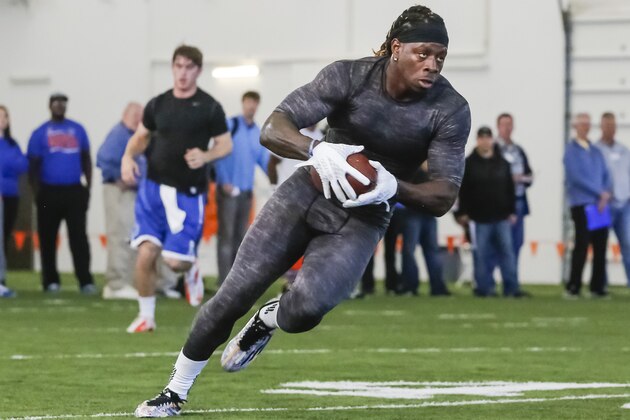 Jay Ajayi performs a receiving drill with a pass thrown by Grant Hedrick during Boise State's NFL football Pro Day in Boise, Idaho, on Wednesday, March 18, 2015. (AP Photo/Otto Kitsinger)