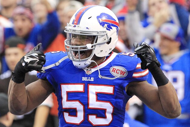 Buffalo Bills defensive end Jerry Hughes celebrates after scoring on a fumble recovery against the Cleveland Browns during the second half of an NFL football game, Sunday, Nov. 30, 2014, in Orchard Park, N.J. (AP Photo/Bill Wippert)