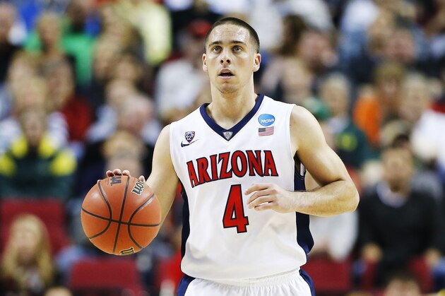 PORTLAND, OR - MARCH 21:  T.J. McConnell #4 of the Arizona Wildcats drives against the Ohio State Buckeyes in the first half during the third round of the 2015 NCAA Men's Basketball Tournament at Moda Center on March 21, 2015 in Portland, Oregon.  (Photo by Jonathan Ferrey/Getty Images)