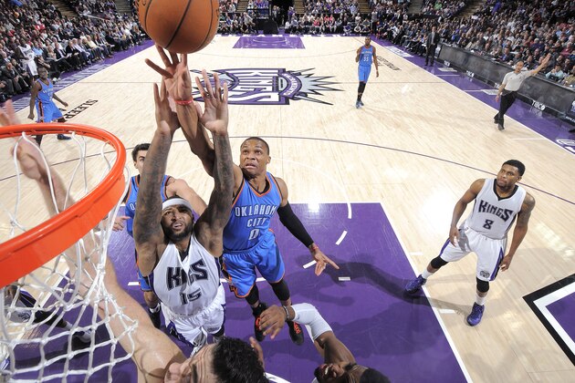 SACRAMENTO, CA - JANUARY 7: Russell Westbrook #0 of the Oklahoma City Thunder tips a shot against DeMarcus Cousins #15 of the Sacramento Kings on January 7, 2015 at Sleep Train Arena in Sacramento, California. NOTE TO USER: User expressly acknowledges and agrees that, by downloading and or using this photograph, User is consenting to the terms and conditions of the Getty Images Agreement. Mandatory Copyright Notice: Copyright 2015 NBAE (Photo by Rocky Widner/NBAE via Getty Images)