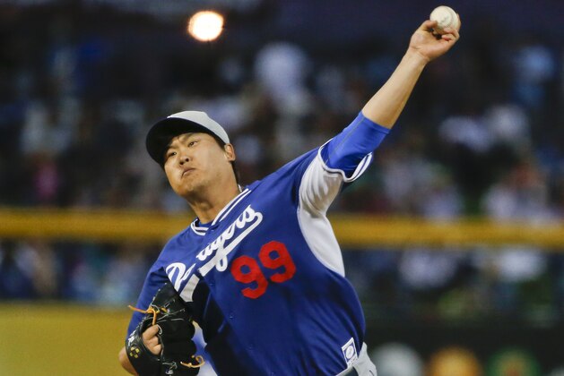Los Angeles Dodgers starting pitcher Hyun-Jin Ryu throws against the San Diego Padres during a spring training baseball game Thursday, March 12, 2015, in Peoria, Ariz.  (AP Photo/Lenny Ignelzi)
