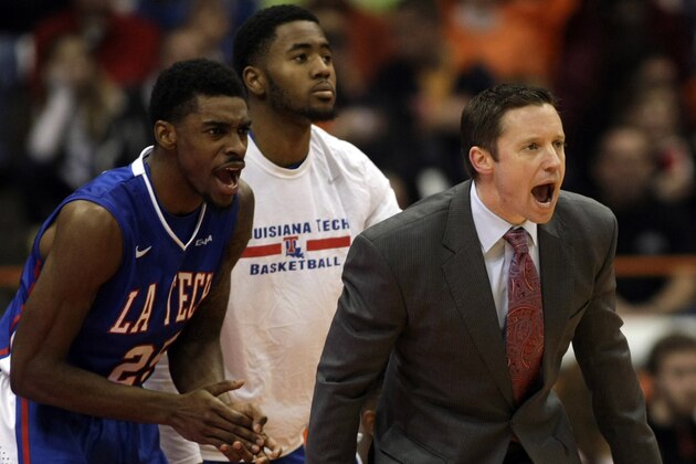 Louisiana Tech head coach Michael White, right, yells to his players in the second half of an NCAA college basketball game against Syracuse in Syracuse, N.Y., Sunday, Dec. 14, 2014. Syracuse won 71-69. (AP Photo/Nick Lisi)