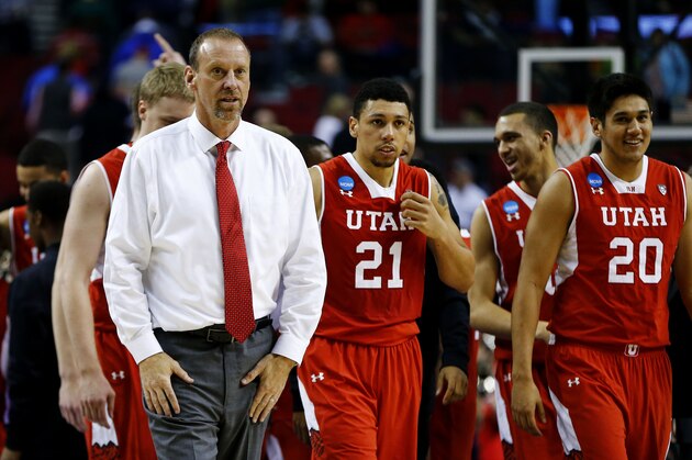 PORTLAND, OR - MARCH 21:  Head coach Larry Krystkowiak of the Utah Utes and his team celebrate their 75 to 64 win over the Georgetown Hoyas during the third round of the 2015 NCAA Men's Basketball Tournament at Moda Center on March 21, 2015 in Portland, Oregon.  (Photo by Jonathan Ferrey/Getty Images)