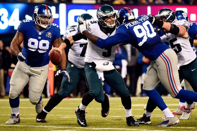 EAST RUTHERFORD, NJ - DECEMBER 28:  Mark Sanchez #3 of the Philadelphia Eagles is sacked by  Jason Pierre-Paul #90 of the New York Giants during a game at MetLife Stadium on December 28, 2014 in East Rutherford, New Jersey.  (Photo by Alex Goodlett/Getty Images)