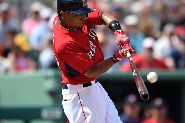 FORT MYERS, FL - MARCH 16:  Mookie Betts #50 of the Boston Red Sox hits a triple during the sixth inning of a spring training game against the New York Mets at JetBlue Park at Fenway South on March 16, 2015 in Fort Myers, Florida.  (Photo by Stacy Revere/Getty Images)