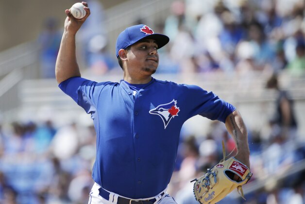 Toronto Blue Jays starting pitcher Roberto Osuna winds up in the first inning of an exhibition baseball game against the Tampa Bay Rays in Dunedin, Fla., Sunday, March 22, 2015. (AP Photo/Kathy Willens)