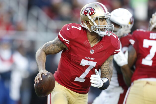 San Francisco 49ers quarterback Colin Kaepernick (7) runs against the Arizona Cardinals 4= an NFL football game in Santa Clara, Calif., Sunday, Dec. 28, 2014. (AP Photo/Tony Avelar)