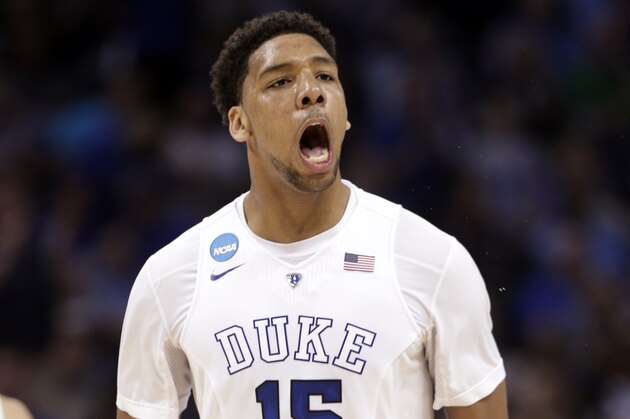 Duke's Jahlil Okafor (15) celebrates after a dunk against San Diego State during the first half of an NCAA tournament college basketball game in the Round of 32 in Charlotte, N.C., Sunday, March 22, 2015. (AP Photo/Nell Redmond)