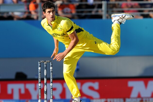 Australian bowler Mitchell Starc watches his delivery during their Cricket World Cup match against New Zealand in Auckland, New Zealand, Saturday, Feb. 28, 2015. (AP Photo Ross Setford)