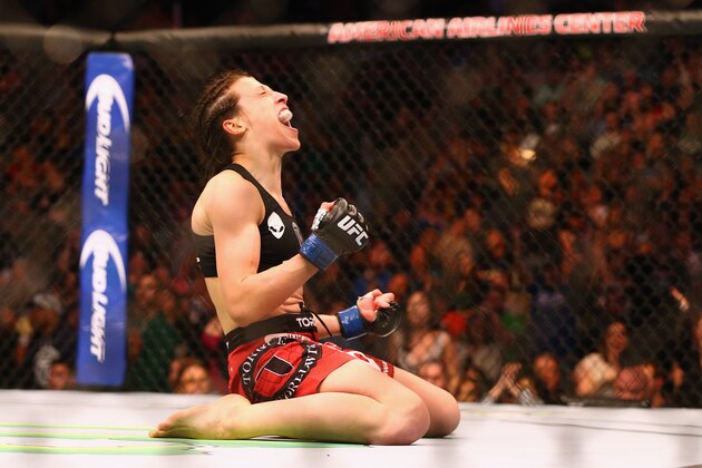 DALLAS, TX - MARCH 14:  Joanna Jedrzejczyk celebrates her TKO against Carla Esparza in the Women's Strawweight bout during the UFC 185 event at American Airlines Center on March 14, 2015 in Dallas, Texas.  (Photo by Ronald Martinez/Getty Images)