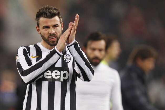 Juventus' Andrea Barzagli salutes supporters during an Italian Cup, round of eight, soccer match, between AS Roma and Juventus at Rome's Olympic stadium, Tuesday, Jan. 21, 2014. (AP Photo/Alessandra Tarantino)