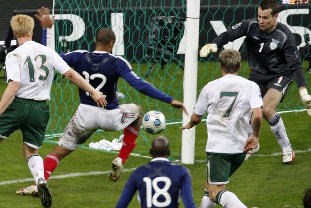 France's Thierry Henry, second left, passes the ball as Ireland's goalkeeper Shay Given, right, tries to stop it, just before William Gallas (unseen) scored the goal for France during their World Cup qualifying playoff second leg soccer match at the Stade de France stadium in Saint Denis outside Paris, Wednesday Nov.18, 2009. At left is Ireland's Paul McShane and Liam Lawrence, (7), is second from the left.(AP Photo/Michel Euler)