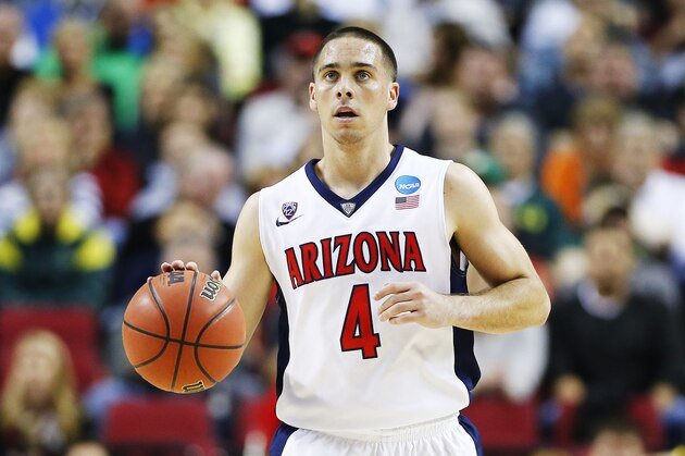 PORTLAND, OR - MARCH 21:  T.J. McConnell #4 of the Arizona Wildcats drives against the Ohio State Buckeyes in the first half during the third round of the 2015 NCAA Men's Basketball Tournament at Moda Center on March 21, 2015 in Portland, Oregon.  (Photo by Jonathan Ferrey/Getty Images)