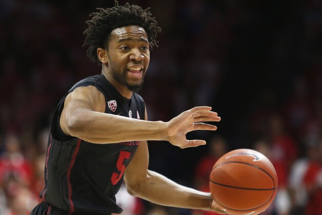Stanford guard Chasson Randle (5) drives on Arizona during the first half of an NCAA college basketball game, Saturday, March 7, 2015, in Tucson, Ariz. (AP Photo/Rick Scuteri)