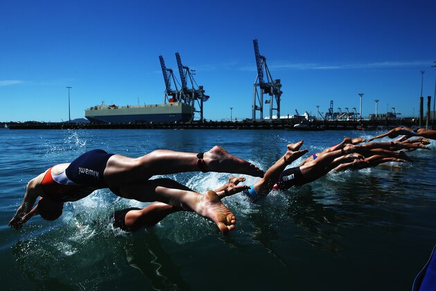 AUCKLAND, NEW ZEALAND - APRIL 06:  Sarissa De Vries of the Netherlands dives in for the swim leg during the ITU World Triathlon Elite Women's race on April 6, 2014 in Auckland, New Zealand.  (Photo by Hannah Peters/Getty Images)