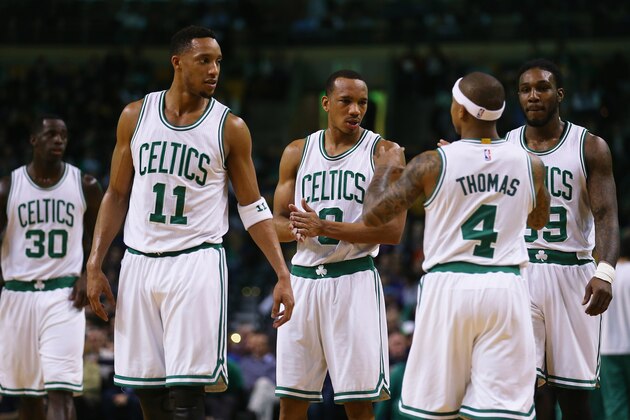 BOSTON, MA - FEBRUARY 25:  Isaiah Thomas #4 talks with Evan Turner #11, Avery Bradley #0, and Jae Crowder #99 of the Boston Celtics during the game against the New York Knicks at TD Garden on February 25, 2015 in Boston, Massachusetts. NOTE TO USER: User expressly acknowledges and agrees that, by downloading and or using this photograph, User is consenting to the terms and conditions of the Getty Images License Agreement.  (Photo by Maddie Meyer/Getty Images)