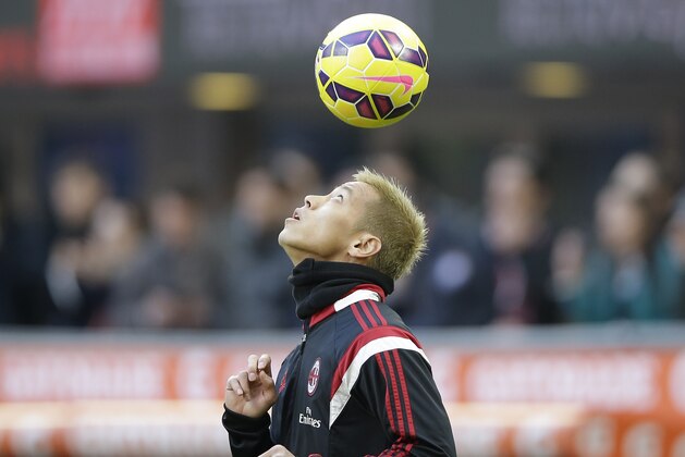 AC Milan's Keisuke Honda controls the ball during the Serie A soccer match between AC Milan and Cesena at the San Siro stadium in Milan, Italy, Sunday, Feb. 22, 2015. (AP Photo/Antonio Calanni)