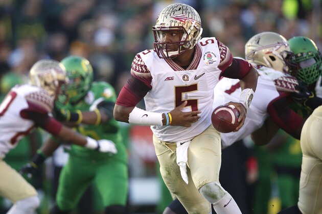 Florida State quarterback Jameis Winston (5) prepares to hand the ball off while facing Oregon in the Rose Bowl NCAA college football playoff semifinal, Thursday, Jan. 1, 2015 in Pasadena, Calif. Oregon defeated Florida State 59-20 to advance to the first ever NCAA football playoff championship game. (AP Photo/Doug Benc)