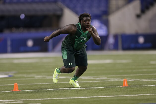 Texas defensive lineman Malcom Brown runs a drill at the NFL football scouting combine in Indianapolis, Sunday, Feb. 22, 2015. (AP Photo/David J. Phillip)