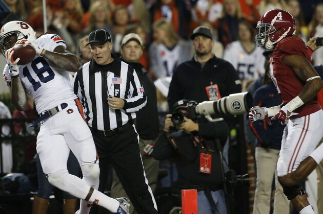 Auburn wide receiver Sammie Coates (18) makes a touch-down catch against Alabama defensive back Eddie Jackson (4) during the first half of the Iron Bowl NCAA college football game, Saturday, Nov. 29, 2014, in Tuscaloosa, Ala. (AP Photo/Brynn Anderson )