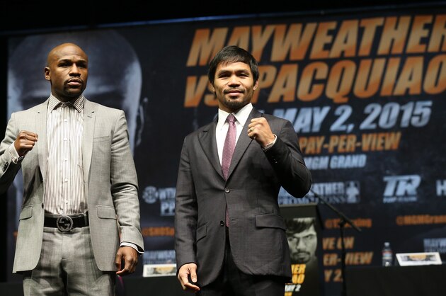LOS ANGELES, CA - MARCH 11:  Floyd Mayweather (L) and Manny Pacquiao pose together at the end of their Press Conference promoting their upcoming fight on March 11, 2015 in Los Angeles, California.  (Photo by Stephen Dunn/Getty Images)