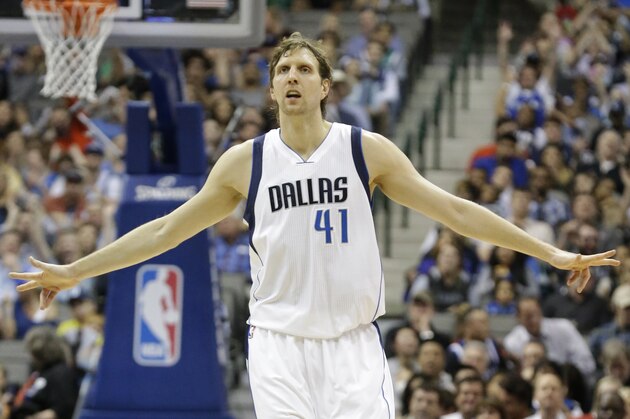Dallas Mavericks forward Dirk Nowitzki (41) reacts after hitting a 3-point basket during the second half of an NBA basketball game against the Orlando Magic, Wednesday, March 18, 2015, in Dallas. The Mavericks won 107-102.  (AP Photo/LM Otero)