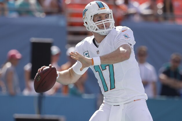 Miami Dolphins quarterback Ryan Tannehill (17) looks to pass during the first half of an NFL football game against the New York Jets, Sunday, Dec. 28, 2014, in Miami Gardens, Fla. (AP Photo/Lynne Sladky)