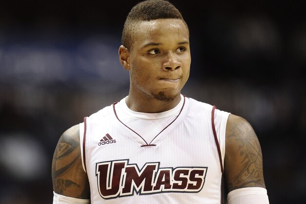 FILE - In this Nov. 22, 2014, file photo, Massachusetts’ Derrick Gordon looks on during the second half of an NCAA college basketball game in Uncasville, Conn. Gordon became a better basketball player and a better teammate this season, and he credits both to having the courage to play as an openly gay man. Gordon's first season since coming out likely ended Thursday in the first round of the Atlantic 10 tournament at Barclays Center. (AP Photo/Jessica Hill, File)