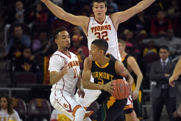 Dec 30, 2014; Los Angeles, CA, USA; Southern California Trojans guard Jordan McLaughlin (11) and forward Nikola Jovanovic (32) defend against Vermont Catamounts guard Tre Bell-Haynes (2) at Galen Center. USC defeated Vermont 64-56. Mandatory Credit: Kirby Lee-USA TODAY Sports